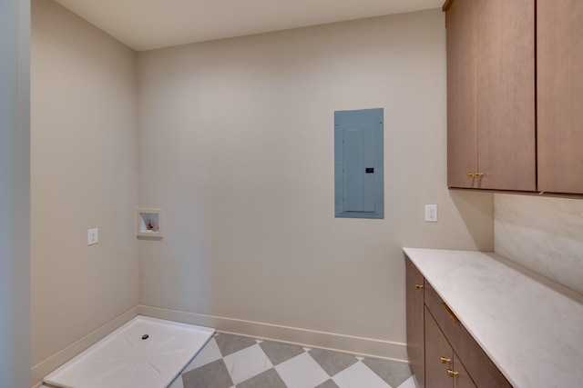 2108 12th Ave S, Nashville, TN 37204 - laundry room with baseboards, electric panel, cabinet space, tile patterned floors, and hookup for a washing machine