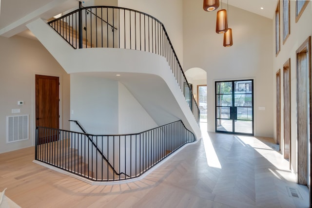 2108 12th Ave S, Nashville, TN 37204 - foyer with visible vents, a high ceiling, parquet flooring, recessed lighting, and stairs
