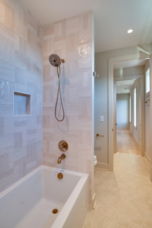 2108 12th Ave S, Nashville, TN 37204 - bathroom featuring shower / tub combination, recessed lighting, toilet, tile patterned floors, and baseboards