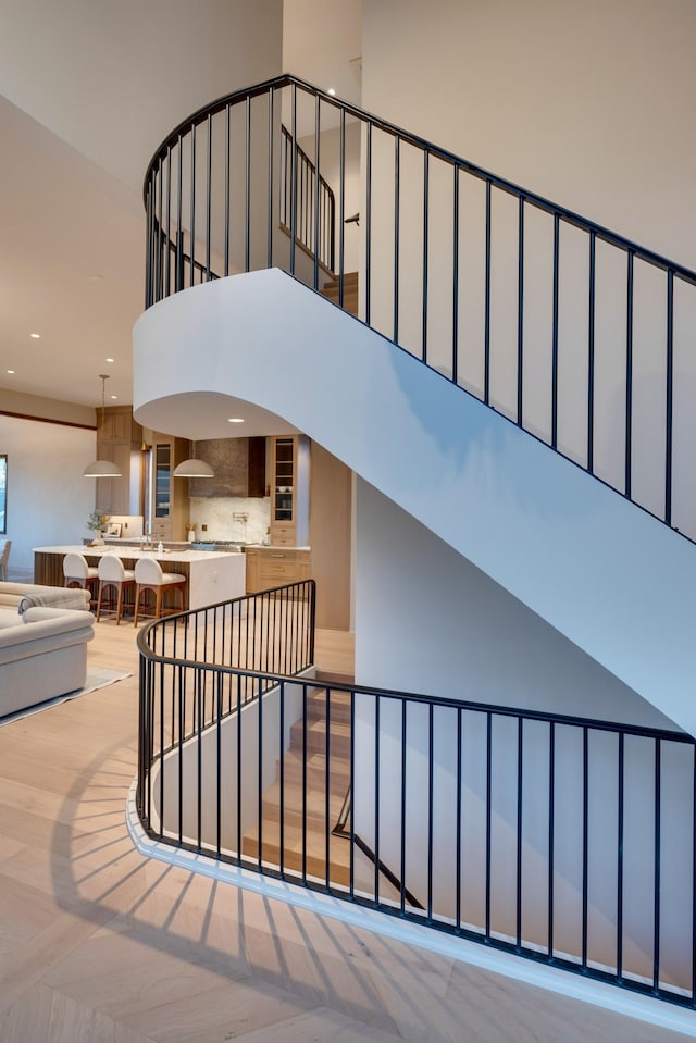 2108 12th Ave S, Nashville, TN 37204 - staircase with recessed lighting, wood finished floors, and a towering ceiling