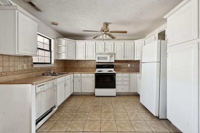 107 Heritage Trace Dr, Madison, TN 37115 - kitchen with ceiling fan, light tile patterned floors, white appliances, visible vents, and a sink