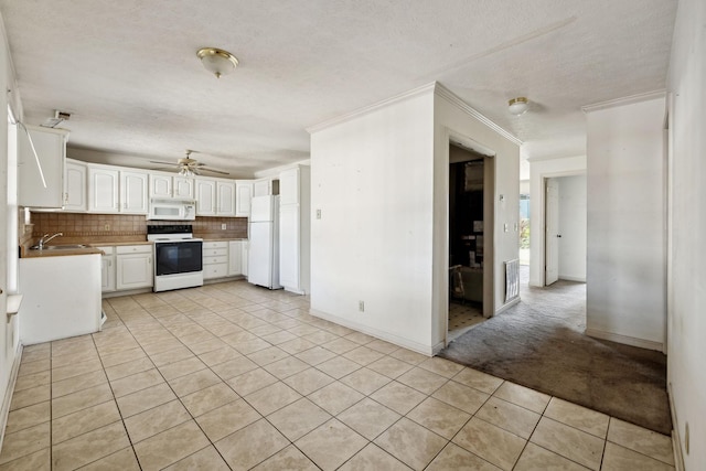 107 Heritage Trace Dr, Madison, TN 37115 - kitchen with white appliances, a ceiling fan, white cabinetry, a sink, and decorative backsplash
