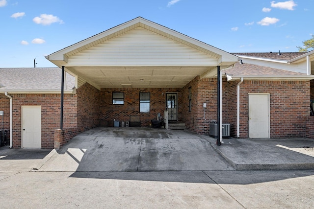 107 Heritage Trace Dr, Madison, TN 37115 - view of front of home with a carport, driveway, roof with shingles, and brick siding