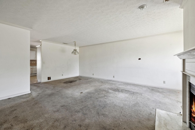 107 Heritage Trace Dr, Madison, TN 37115 - unfurnished living room with a textured ceiling, ornamental molding, a warm lit fireplace, and carpet floors