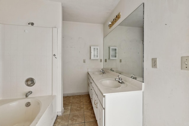107 Heritage Trace Dr, Madison, TN 37115 - bathroom featuring double vanity, a sink, tile patterned flooring, and baseboards