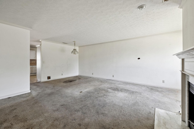 107 Heritage Trace Dr, Madison, TN 37115 - unfurnished living room featuring a fireplace, carpet, a textured ceiling, and ornamental molding
