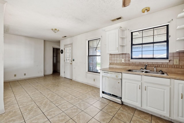 107 Heritage Trace Dr, Madison, TN 37115 - kitchen with dishwasher, a sink, open shelves, and decorative backsplash