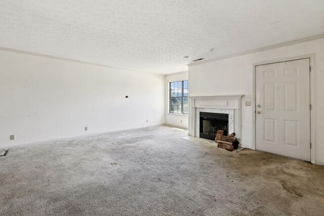 107 Heritage Trace Dr, Madison, TN 37115 - unfurnished living room with visible vents, baseboards, carpet, a high end fireplace, and a textured ceiling