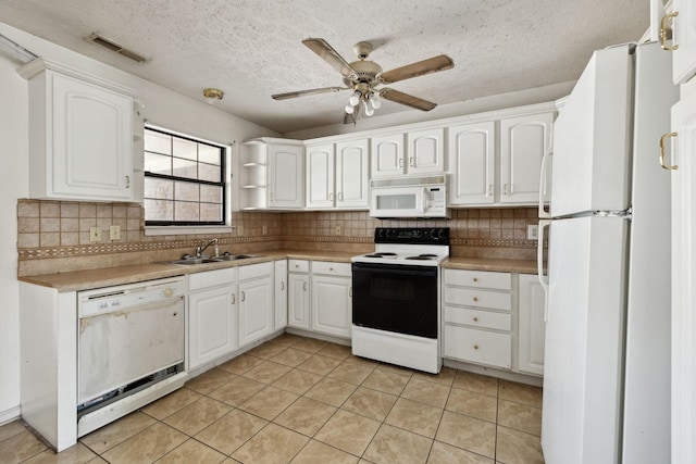 107 Heritage Trace Dr, Madison, TN 37115 - kitchen with visible vents, white cabinets, a sink, a ceiling fan, and white appliances