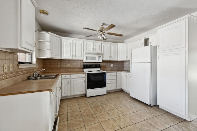 107 Heritage Trace Dr, Madison, TN 37115 - kitchen featuring tasteful backsplash, white appliances, light tile patterned flooring, ceiling fan, and a sink