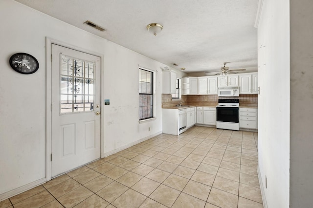 107 Heritage Trace Dr, Madison, TN 37115 - kitchen with white appliances, white cabinets, visible vents, ceiling fan, and decorative backsplash