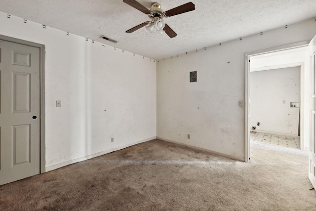 107 Heritage Trace Dr, Madison, TN 37115 - carpeted spare room with a textured ceiling, baseboards, a ceiling fan, and visible vents