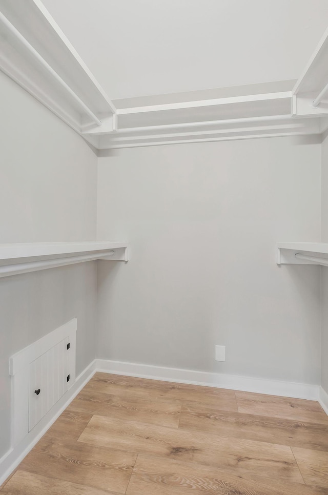walk in closet featuring light wood-style floors