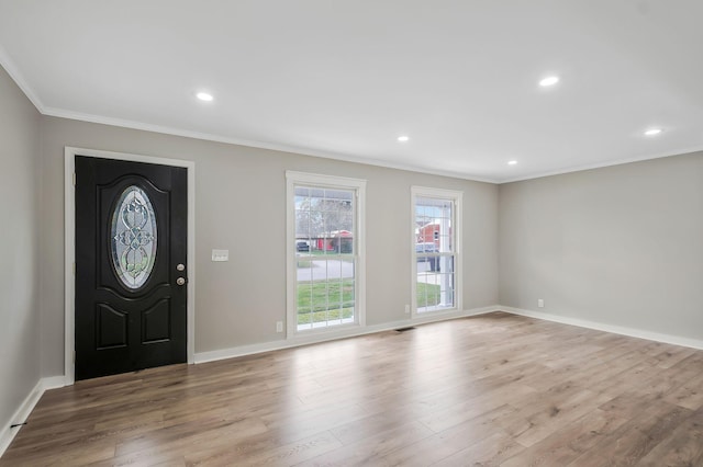 entryway with baseboards, wood finished floors, recessed lighting, and crown molding