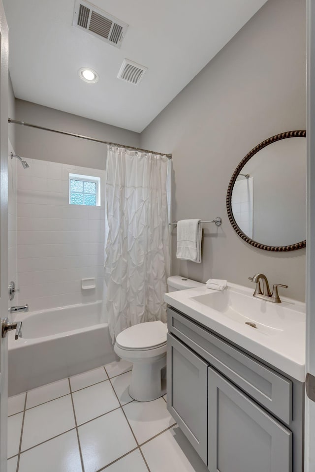 full bathroom with visible vents, toilet, vanity, and tile patterned floors