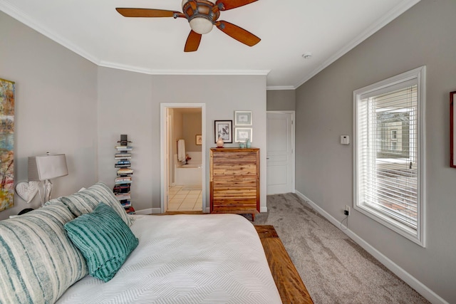 bedroom featuring ornamental molding, baseboards, ensuite bathroom, and carpet