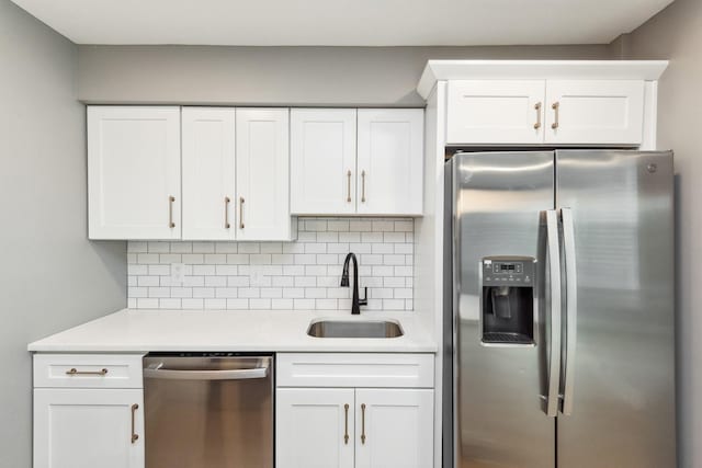 2129 Acklen Ave Unit 12, Nashville, TN 37212 - kitchen with a sink, light countertops, decorative backsplash, and appliances with stainless steel finishes