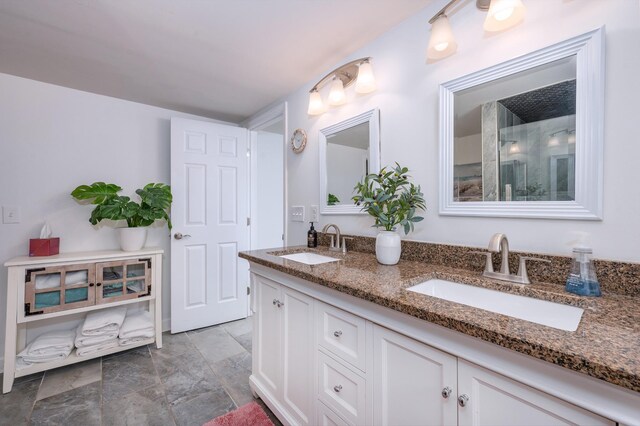 full bath featuring double vanity and a sink