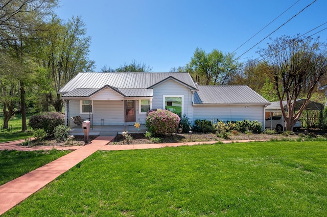 ranch-style home with a front yard, a porch, and metal roof