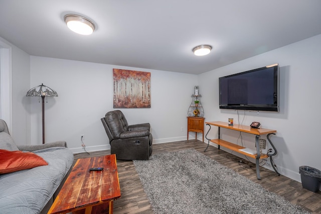 living room with baseboards and wood finished floors