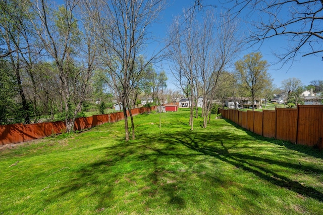 view of yard with a fenced backyard