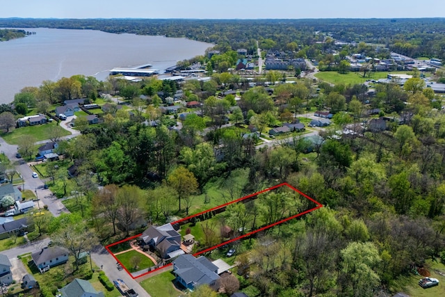 bird's eye view with a forest view and a water view