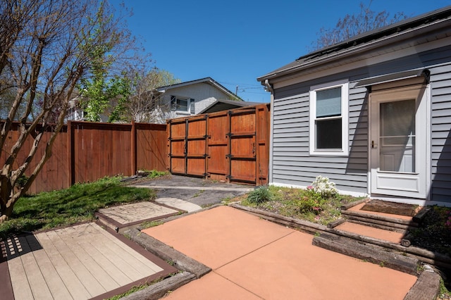 view of patio / terrace with fence and a gate