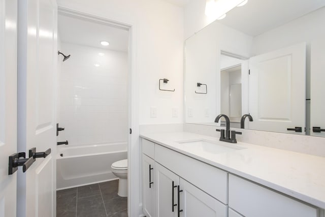 full bathroom featuring vanity, bathtub / shower combination, and toilet