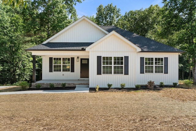6149 Dewey Carr Rd, Bethpage, TN 37022 - modern farmhouse featuring roof with shingles and covered porch