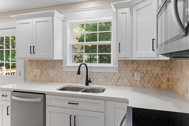6149 Dewey Carr Rd, Bethpage, TN 37022 - kitchen with appliances with stainless steel finishes, light countertops, white cabinetry, and tasteful backsplash