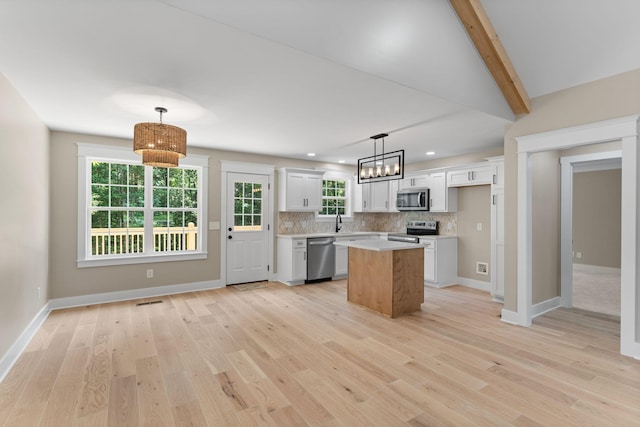 6149 Dewey Carr Rd, Bethpage, TN 37022 - kitchen featuring stainless steel appliances, light wood finished floors, light countertops, backsplash, and recessed lighting
