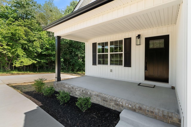 6149 Dewey Carr Rd, Bethpage, TN 37022 - property entrance with a porch and board and batten siding