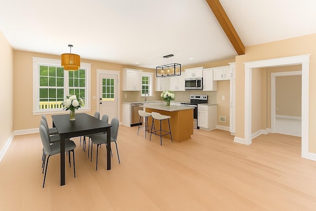 6149 Dewey Carr Rd, Bethpage, TN 37022 - dining room featuring light wood-style floors, plenty of natural light, recessed lighting, a chandelier, and beamed ceiling