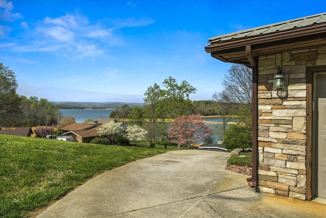 view of patio with a water view