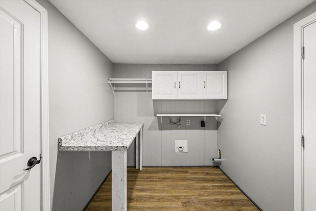 laundry room with cabinet space, recessed lighting, wood finished floors, and washer hookup