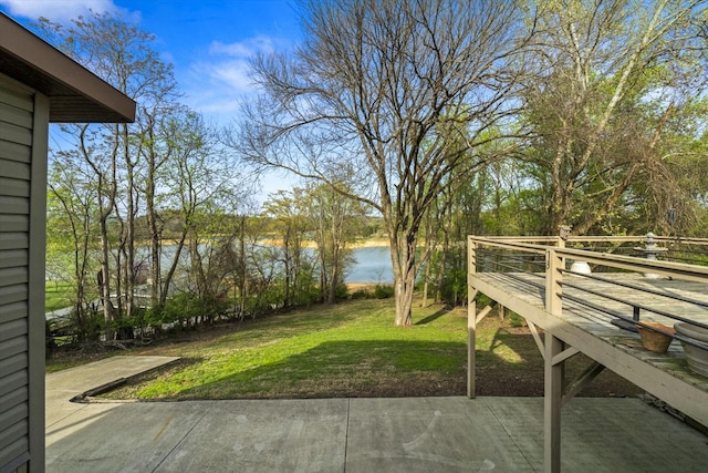 view of yard featuring a patio area and a water view