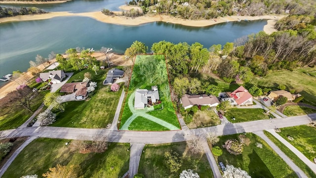 birds eye view of property with a water view and a residential view