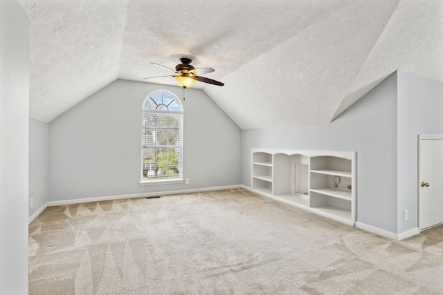 3227 Gardendale Dr, Franklin, TN 37064 - additional living space with built in shelves, a ceiling fan, carpet flooring, and a textured ceiling