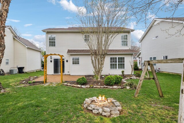 3227 Gardendale Dr, Franklin, TN 37064 - rear view of property featuring a fire pit, a yard, and central AC
