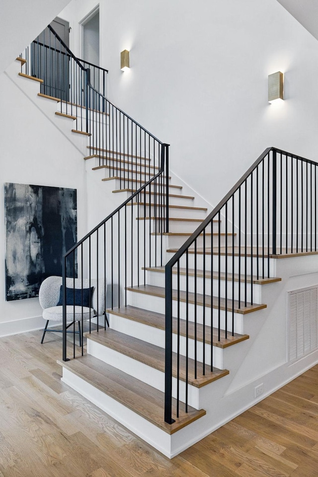 6004 Jocelyn Hollow Rd, Nashville, TN 37205 - staircase featuring visible vents, baseboards, and wood finished floors