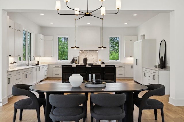 6004 Jocelyn Hollow Rd, Nashville, TN 37205 - dining room featuring a wealth of natural light, light wood finished floors, and an inviting chandelier