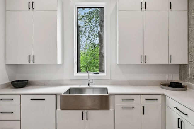 6004 Jocelyn Hollow Rd, Nashville, TN 37205 - kitchen with a wealth of natural light, white cabinetry, and a sink