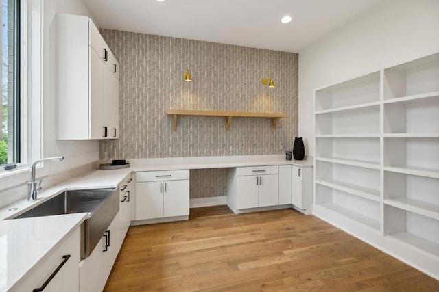 6004 Jocelyn Hollow Rd, Nashville, TN 37205 - kitchen featuring light wood finished floors, white cabinetry, a sink, and open shelves