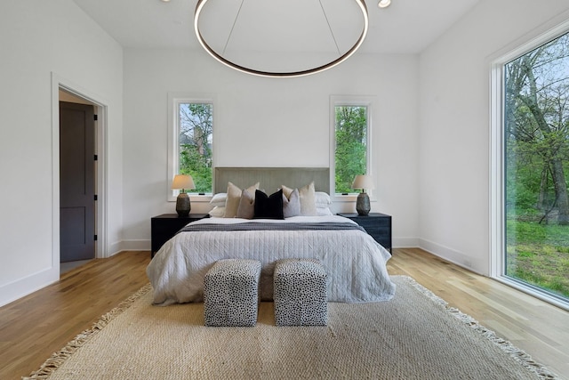 6004 Jocelyn Hollow Rd, Nashville, TN 37205 - bedroom featuring multiple windows, baseboards, and wood finished floors