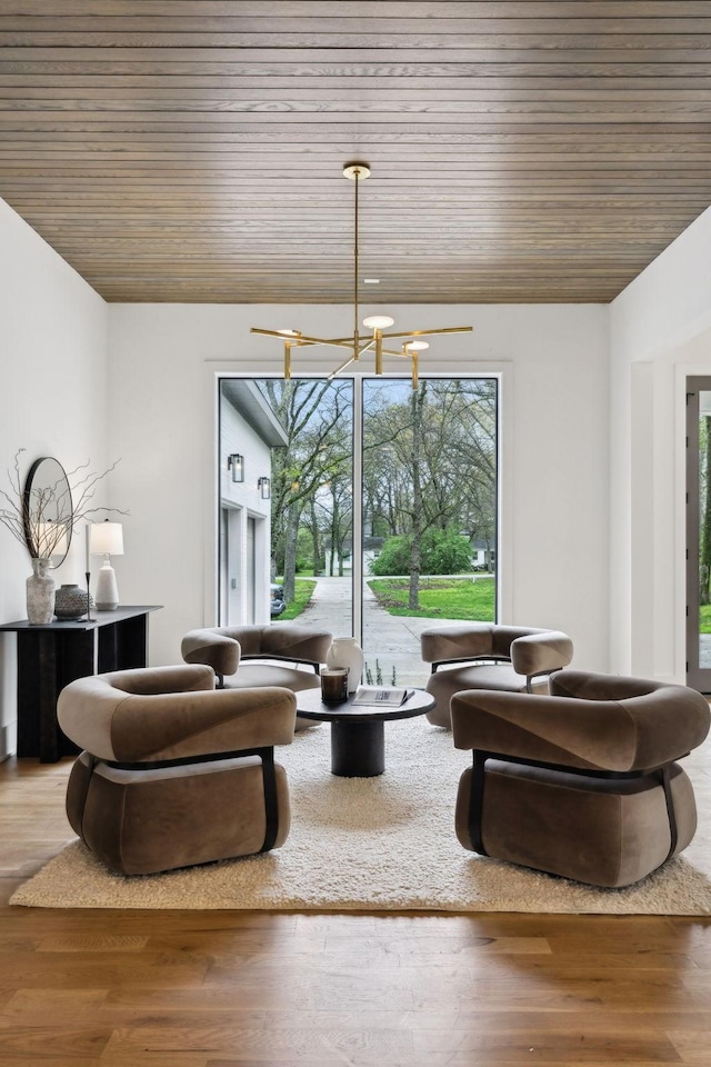 6004 Jocelyn Hollow Rd, Nashville, TN 37205 - living room featuring a notable chandelier, wood ceiling, and wood finished floors