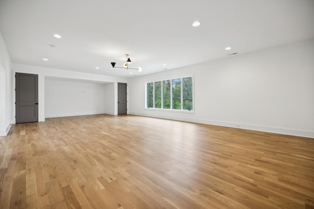 6004 Jocelyn Hollow Rd, Nashville, TN 37205 - spare room with light wood-style flooring, baseboards, a notable chandelier, and recessed lighting