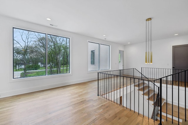 6004 Jocelyn Hollow Rd, Nashville, TN 37205 - empty room with plenty of natural light, visible vents, baseboards, and wood finished floors