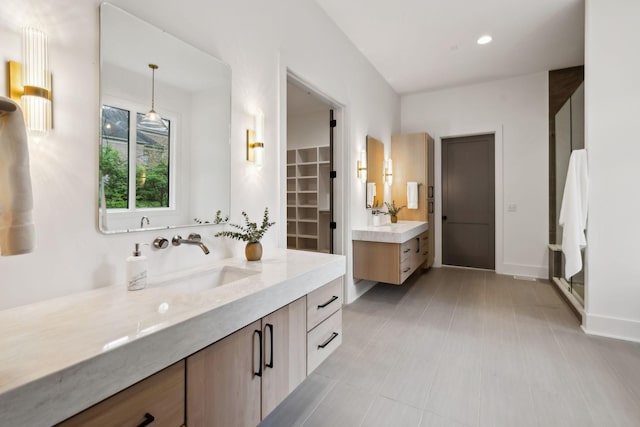 6004 Jocelyn Hollow Rd, Nashville, TN 37205 - full bath featuring two vanities, a sink, baseboards, and recessed lighting