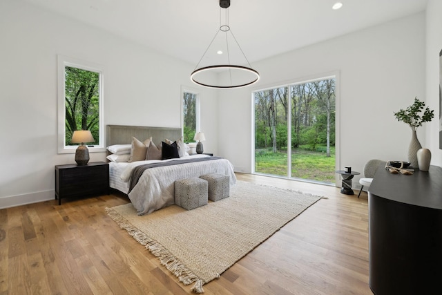 6004 Jocelyn Hollow Rd, Nashville, TN 37205 - bedroom featuring multiple windows and wood finished floors