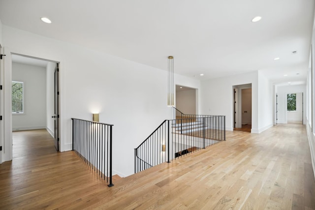 6004 Jocelyn Hollow Rd, Nashville, TN 37205 - hall featuring light wood-style flooring, an upstairs landing, and a wealth of natural light